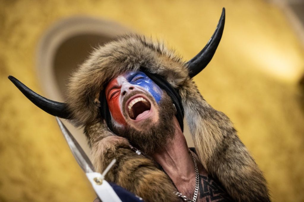 QAnon Shaman Sues Trump for $40 Trillion and Targets Musk, T-Mobile and Warner Bros in Rambling Lawsuit
