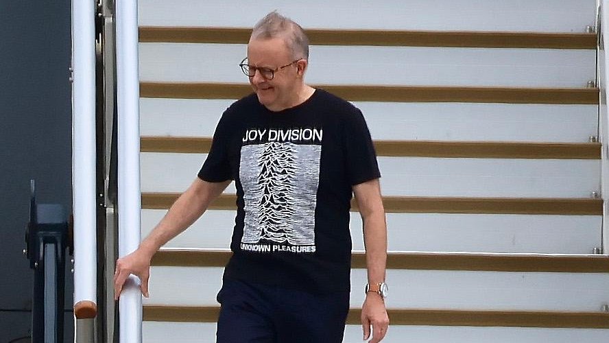 Anthony Albanese asked Media not to Film him Wearing Joy Division T-shirt while Disembarking from Plane after US Trip